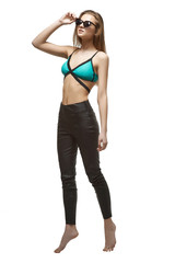 Young happy woman in summer outfit  isolated оn white background. Sport swimwear. Perfect figure.