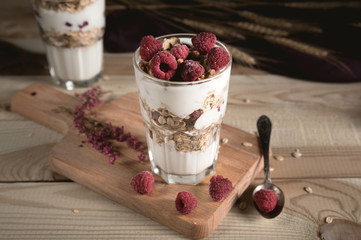 Yogurt parfait with granola and fresh raspberries