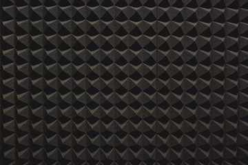 Strong protection from loud music. Close up view of a grey soundproof coverage for a recording studio