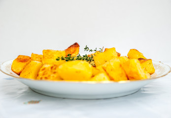 Baked potatoes in a white plate