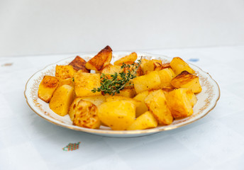 Baked potatoes in a white plate