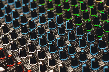 Obraz premium Professional Sound Mixer. Close-up view of colorful control buttons for sound adjusting in a recording studio