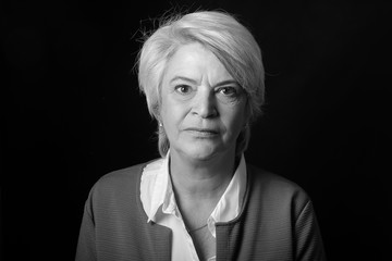 Portrait of a mature woman doing facial expressions