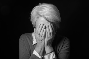 Portrait of a mature woman doing facial expressions