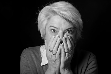 Portrait of a mature woman doing facial expressions