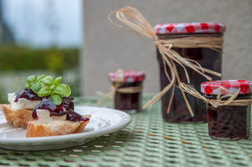 Homemade sloe jams on the rustic table