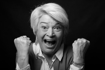 Portrait of a mature woman doing facial expressions