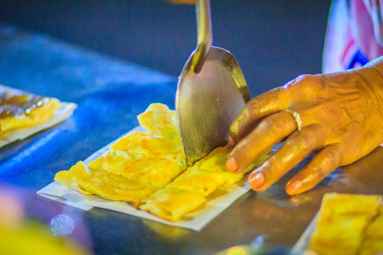 Close up vendor cooking for southern flat bread, mataba, or roti, the popular street food in the night market, Bangkok, Thailand. Kind of Muslim and Indian food