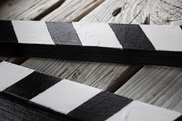 abstraction, movie cracker on white wooden background