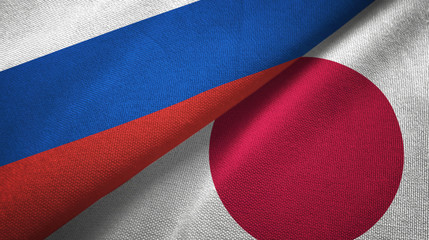 Russia and Japan two flags textile cloth, fabric texture