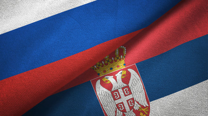 Russia and Serbia two flags textile cloth, fabric texture
