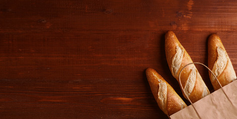 french baguette in a rustic style on a wooden table
