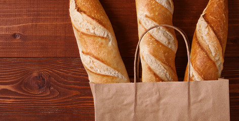 fresh bread in a paper bag. small bakery concept with gluten free flavored bread