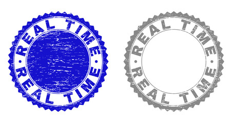 Grunge REAL TIME stamp seals isolated on a white background. Rosette seals with grunge texture in blue and grey colors. Vector rubber watermark of REAL TIME title inside round rosette.