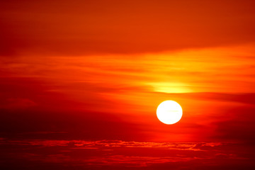 last light sunset on the red cloud sky ray around sun