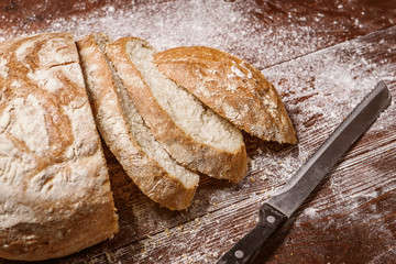 sliced bread on a wooden table. fresh baking concept