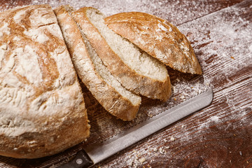 sliced bread on a wooden table. fresh baking concept