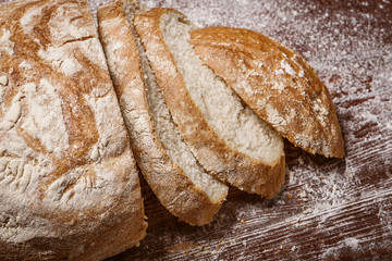 sliced bread on a wooden table. fresh baking concept