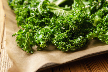 Fototapeta premium Close-up of raw kale with oli and sesame