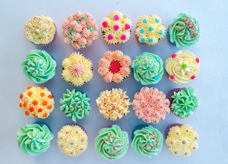 Homemade, colorful cupcakes on white background