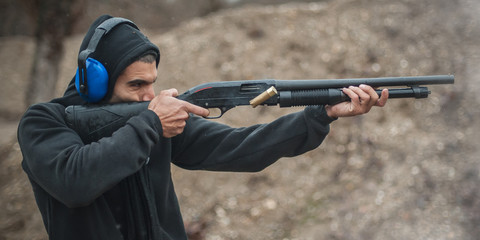 Combat shotgun shooting training. Long gun, pump gun and scattergun