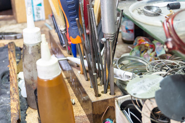 Obraz na płótnie Canvas Screwdrivers and a different set of tools in the metal workshop.