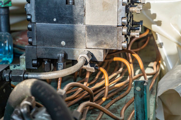 The hydraulic system of the metalworking machine is being repaired.