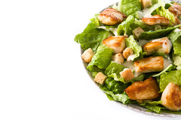 Caesar salad with lettuce,chicken and croutons isolated on white background. Copyspace