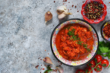 Spicy chili sauce with spices, herbs. Tomato sauce with cilantro.