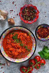 Spicy chili sauce with spices, herbs. Tomato sauce with cilantro.