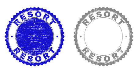 Grunge RESORT stamp seals isolated on a white background. Rosette seals with distress texture in blue and grey colors. Vector rubber stamp imprint of RESORT label inside round rosette.