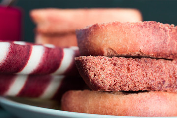 waffle rolls on a plate coffee mug on a dark background