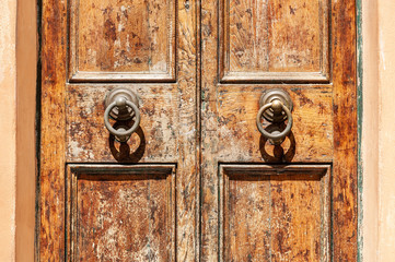 Old wooden door close up. Ancient architecture in Rome, Italy.