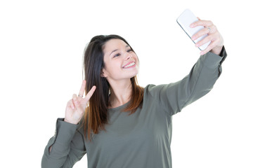 Cute young woman making selfie photo with phone smartphone