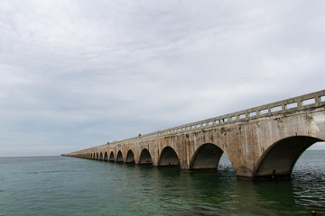 The Seven Mile Bridge is a famous bridge in the Florida Keys, United States approximately 10.9 kilometres long that connects Knight's Key to Little Duck Keys
