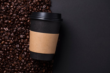 Take away black coffee cup with roasted coffee beans