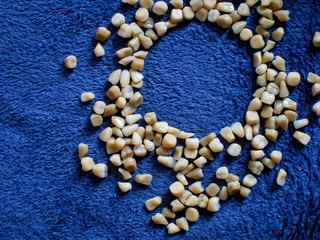 Plastic teeth. Plastic teeth scattered on a blue bedspread.