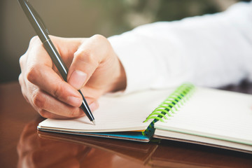 woman hand pen with notepad