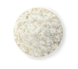 Fototapeta na wymiar Bowl of boiled rice on white background, top view