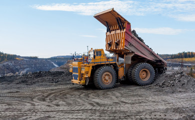 Fototapeta premium Dump truck on unloading