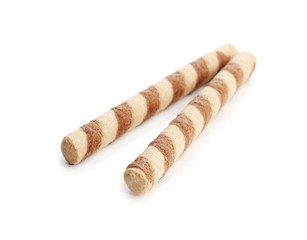 Delicious wafer rolls on white background. Sweet food