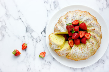 Fresh strawberry bundt cake, homemade  sponge cake ring shaped with strawberry slices