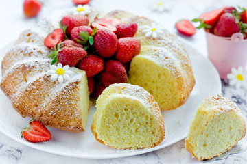 Fresh strawberry bundt cake, homemade  sponge cake ring shaped with strawberry slices