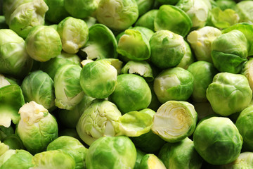 Tasty fresh Brussels sprouts as background, closeup