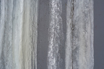 Frozen streams of water on a metal surface