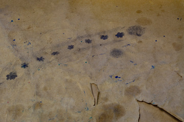 Texture of old, crumpled paper with ink traces.