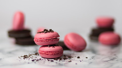 Pink macaroons with black cookies
