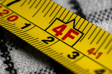 Yellow Tape measure showing measurement in metres and feet