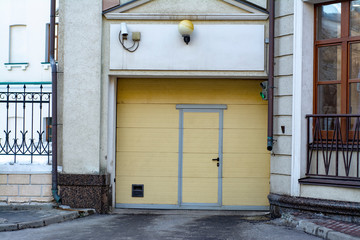 Closed gate to a public garage in a residential building