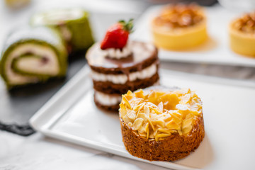 delicious strawberry and mint cakes on a white and black plate
